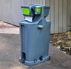 portable hand washing station on a walk way